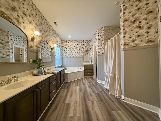 120 Oakhurst Ter NE, Calhoun, GA 30701 - full bath with wallpapered walls, a garden tub, wood finished floors, curtained shower, and double vanity