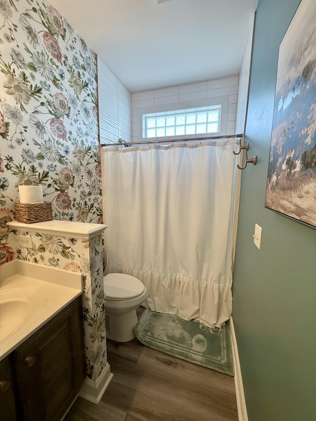 120 Oakhurst Ter NE, Calhoun, GA 30701 - full bathroom featuring wood finished floors, vanity, and wallpapered walls