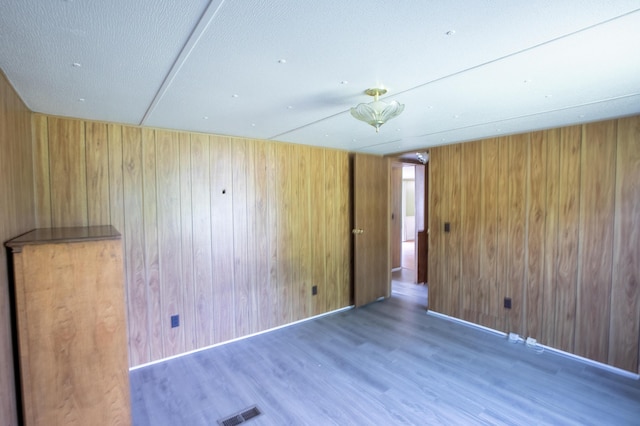 272 Walker Rd, Rossville, GA 30741 - spare room featuring wood finished floors and wood walls
