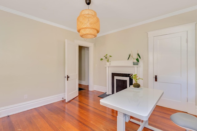 1132 Dartmouth St, Chattanooga, TN 37405 - dining space featuring a fireplace, ornamental molding, and wood finished floors