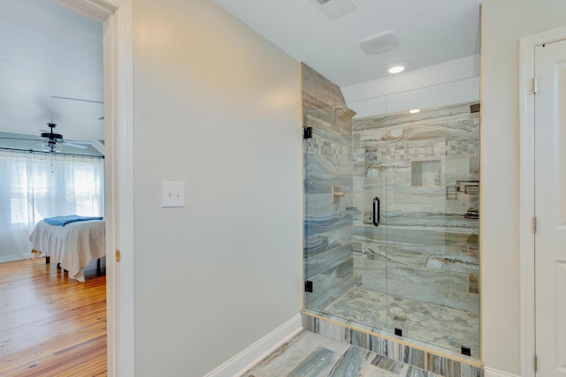 1132 Dartmouth St, Chattanooga, TN 37405 - full bathroom featuring a shower stall, connected bathroom, ceiling fan, and wood finished floors