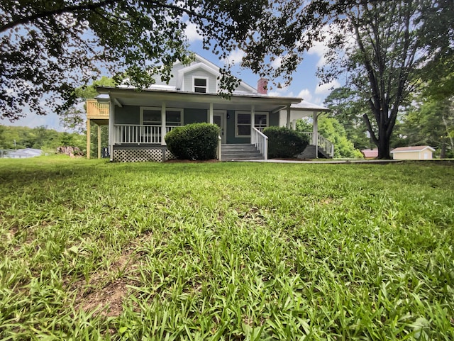 1116 Magnolia St, Lafayette, GA 30728 - view of front of home featuring a chimney, covered porch, and a front yard