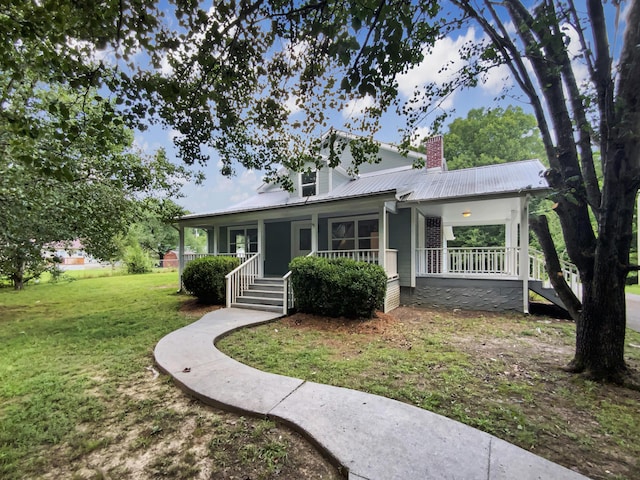 1116 Magnolia St, Lafayette, GA 30728 - view of front of property with covered porch, a front lawn, a chimney, a metal roof, and stairs