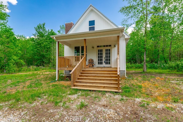 483 W Reed Rd, Lafayette, GA 30728 - view of front of home featuring a chimney, french doors, and covered porch