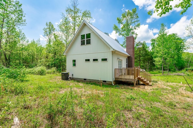 483 W Reed Rd, Lafayette, GA 30728 - back of property with crawl space, a wooden deck, and a chimney