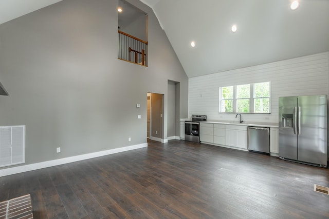 483 W Reed Rd, Lafayette, GA 30728 - unfurnished living room featuring high vaulted ceiling, dark wood finished floors, and recessed lighting