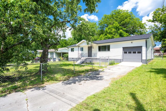 1306 Raydine Ln, Rossville, GA 30741 - single story home with a fenced front yard, an attached garage, and asphalt driveway