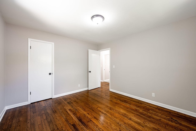1306 Raydine Ln, Rossville, GA 30741 - unfurnished bedroom with baseboards and dark wood-style flooring
