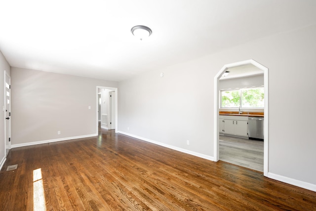 1306 Raydine Ln, Rossville, GA 30741 - empty room with wood finished floors and arched walkways