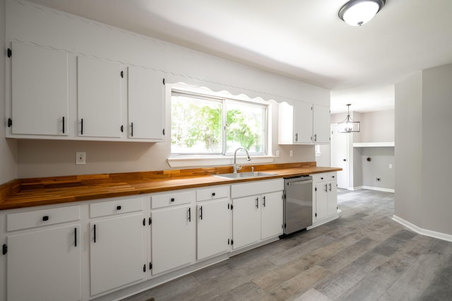 1306 Raydine Ln, Rossville, GA 30741 - kitchen featuring stainless steel dishwasher, butcher block countertops, light wood-type flooring, and white cabinets