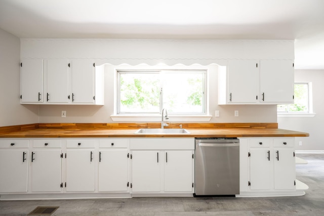 1306 Raydine Ln, Rossville, GA 30741 - kitchen featuring stainless steel dishwasher, wood counters, healthy amount of natural light, and white cabinetry