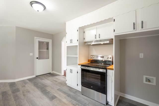 1306 Raydine Ln, Rossville, GA 30741 - kitchen with stainless steel range with electric cooktop, under cabinet range hood, light wood-style flooring, and white cabinets