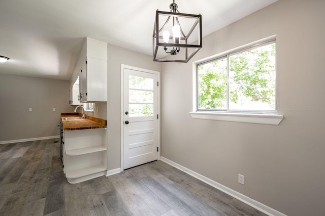 1306 Raydine Ln, Rossville, GA 30741 - doorway with dark wood finished floors and a chandelier