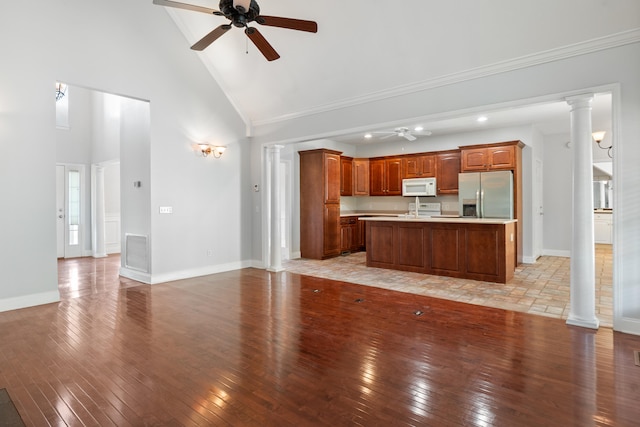 1502 Brock Cir, Ringgold, GA 30736 - kitchen featuring stainless steel fridge, white microwave, a ceiling fan, high vaulted ceiling, and light wood finished floors