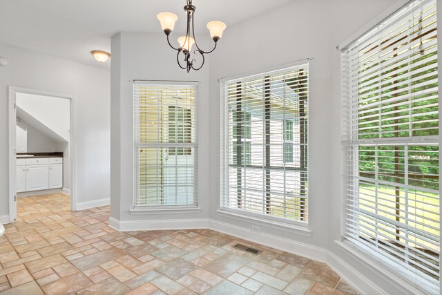 1502 Brock Cir, Ringgold, GA 30736 - unfurnished dining area featuring a chandelier and light stone finish floors