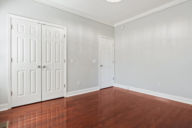 1502 Brock Cir, Ringgold, GA 30736 - unfurnished bedroom with ornamental molding, wood finished floors, and a closet
