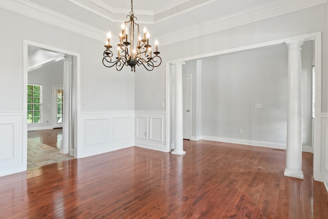 1502 Brock Cir, Ringgold, GA 30736 - unfurnished dining area featuring wood-type flooring, ornamental molding, a chandelier, decorative columns, and a decorative wall
