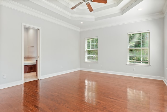 1502 Brock Cir, Ringgold, GA 30736 - spare room with crown molding, wood finished floors, ceiling fan, a tray ceiling, and recessed lighting