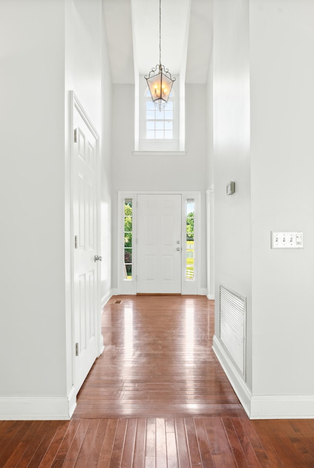 1502 Brock Cir, Ringgold, GA 30736 - entrance foyer featuring a chandelier, dark wood-style floors, and a towering ceiling
