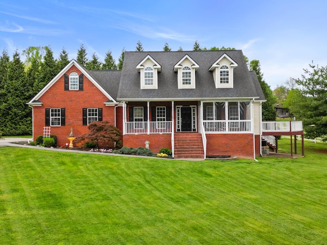 1502 Brock Cir, Ringgold, GA 30736 - cape cod house featuring stairway, brick siding, a front yard, and a sunroom