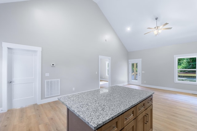 307 Cavender St, Lafayette, GA 30728 - kitchen with high vaulted ceiling, ceiling fan, light wood-type flooring, open floor plan, and light stone countertops