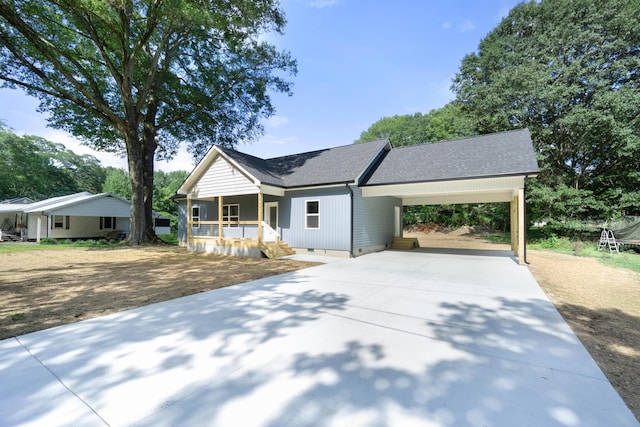 307 Cavender St, Lafayette, GA 30728 - view of front of home featuring covered porch, driveway, a shingled roof, an attached carport, and crawl space