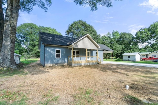 307 Cavender St, Lafayette, GA 30728 - view of front facade featuring a porch, crawl space, driveway, roof with shingles, and an attached carport