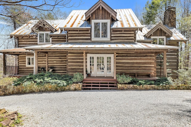 1908 Clear Brooks Dr, Signal Mountain, TN 37377 - rear view of house featuring a metal roof, a standing seam roof, a chimney, and log exterior