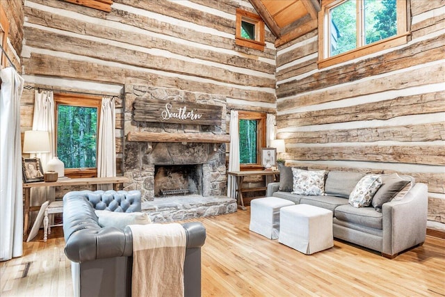 1908 Clear Brooks Dr, Signal Mountain, TN 37377 - living room featuring wooden walls, a fireplace, wood finished floors, and high vaulted ceiling