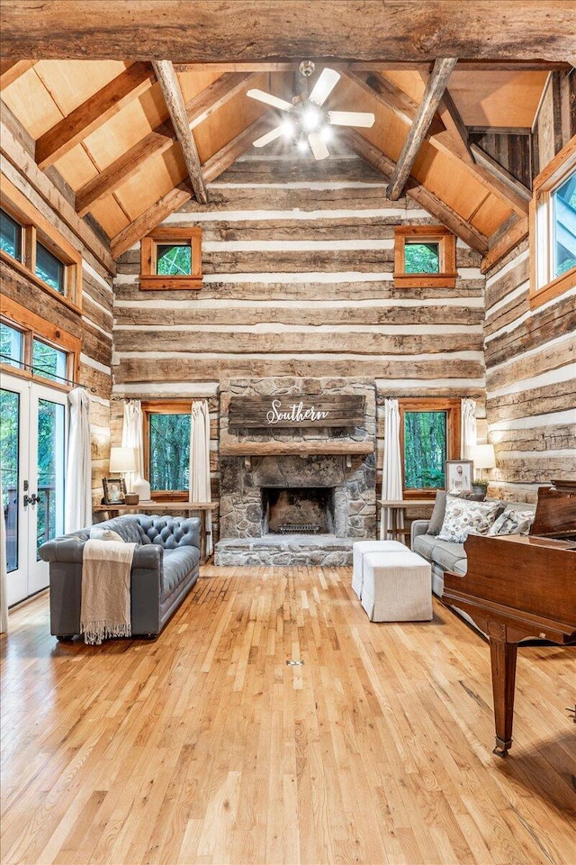 1908 Clear Brooks Dr, Signal Mountain, TN 37377 - living area with high vaulted ceiling, wood-type flooring, a wooden ceiling with exposed beams, ceiling fan, and a stone fireplace