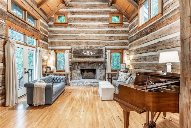 1908 Clear Brooks Dr, Signal Mountain, TN 37377 - living room featuring high vaulted ceiling, wood-type flooring, a fireplace, a wood ceiling with exposed beams, and french doors