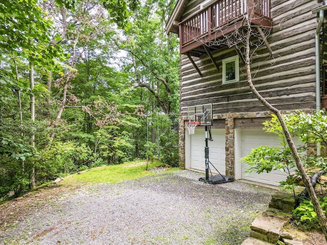 1908 Clear Brooks Dr, Signal Mountain, TN 37377 - view of property exterior featuring an attached garage and gravel driveway