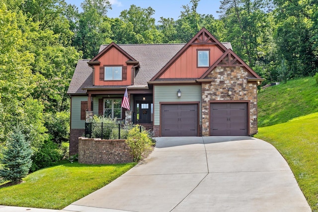 9795 Trestle Cir, Ooltewah, TN 37363 - craftsman-style house featuring a front lawn, concrete driveway, board and batten siding, and stone siding
