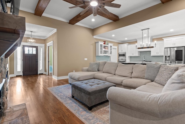 9795 Trestle Cir, Ooltewah, TN 37363 - living room featuring ceiling fan, dark wood finished floors, beam ceiling, recessed lighting, and ornamental molding