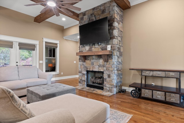 9795 Trestle Cir, Ooltewah, TN 37363 - living area featuring a ceiling fan, a fireplace, wood finished floors, beam ceiling, and french doors