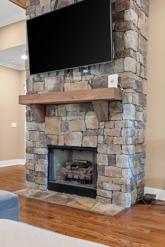 9795 Trestle Cir, Ooltewah, TN 37363 - detailed view of crown molding, a fireplace, and wood finished floors