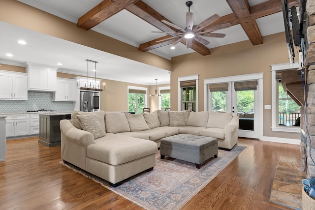 9795 Trestle Cir, Ooltewah, TN 37363 - living area featuring a ceiling fan, coffered ceiling, a chandelier, healthy amount of natural light, and beam ceiling