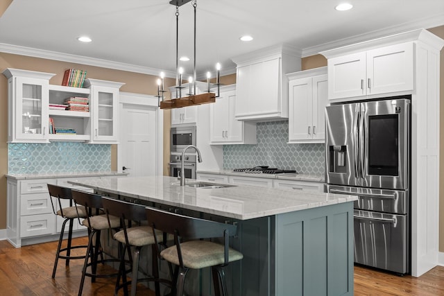 9795 Trestle Cir, Ooltewah, TN 37363 - kitchen with stainless steel appliances, white cabinets, decorative backsplash, crown molding, and recessed lighting