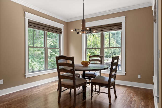 9795 Trestle Cir, Ooltewah, TN 37363 - dining area featuring a chandelier, ornamental molding, and wood finished floors