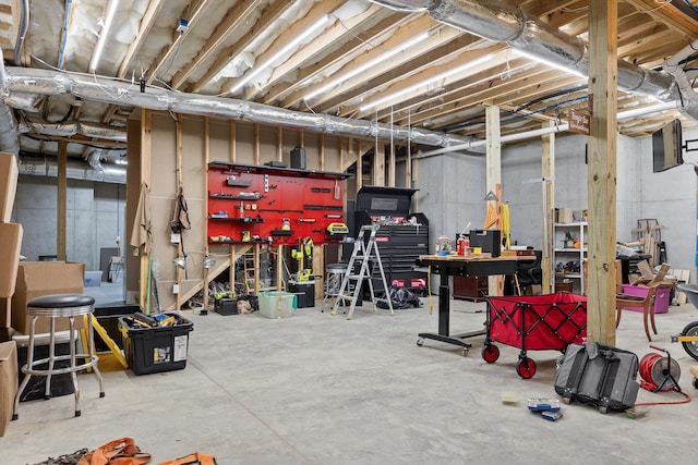 9795 Trestle Cir, Ooltewah, TN 37363 - unfinished below grade area with a workshop area