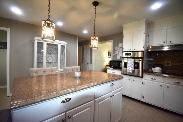 268 Lawrence Dr, Rossville, GA 30741 - kitchen with black appliances, under cabinet range hood, white cabinets, tile patterned floors, and recessed lighting