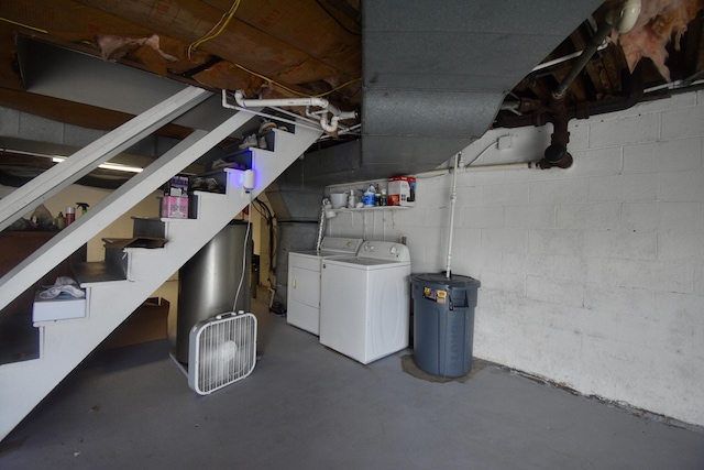 268 Lawrence Dr, Rossville, GA 30741 - unfinished basement featuring independent washer and dryer, concrete block wall, and stairway