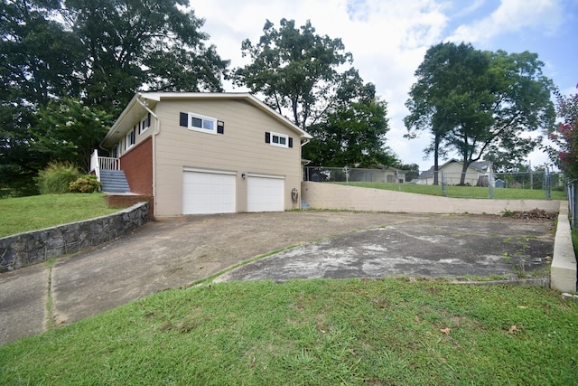 268 Lawrence Dr, Rossville, GA 30741 - view of side of home with asphalt driveway and a garage