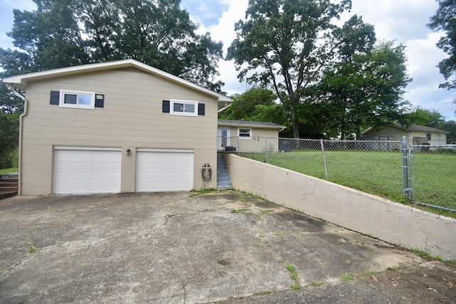 268 Lawrence Dr, Rossville, GA 30741 - view of side of home with an attached garage and concrete driveway