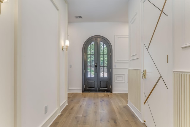 807 Judd Ter, Dalton, GA 30720 - foyer entrance featuring french doors, arched walkways, and light wood finished floors