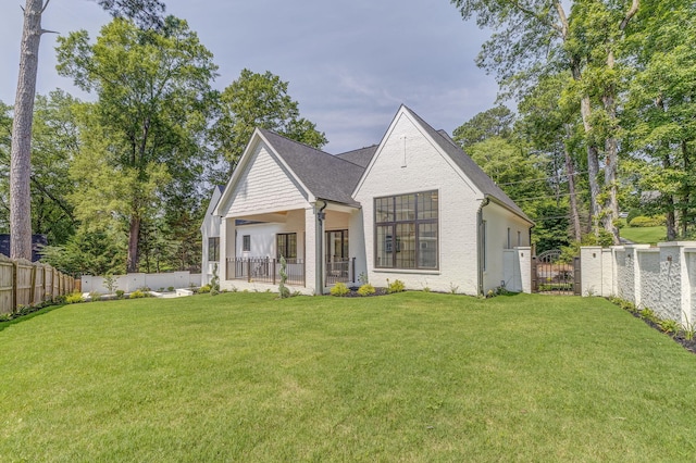 807 Judd Ter, Dalton, GA 30720 - rear view of house with a fenced backyard and a gate