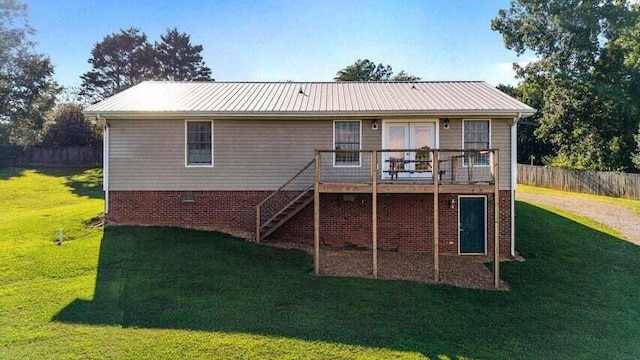 346 Thomas Rd, Benton, TN 37307 - back of property with stairs, a wooden deck, and a metal roof