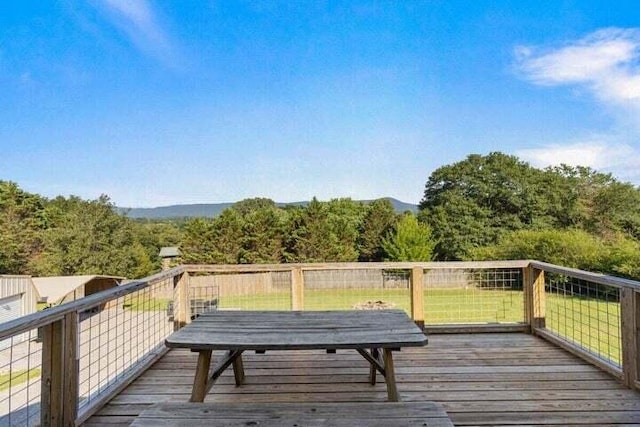 346 Thomas Rd, Benton, TN 37307 - deck featuring a lawn