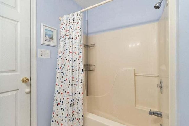 346 Thomas Rd, Benton, TN 37307 - bathroom with shower / bath combination with curtain