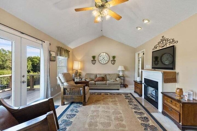 346 Thomas Rd, Benton, TN 37307 - living area with healthy amount of natural light, vaulted ceiling, a ceiling fan, and a fireplace with flush hearth